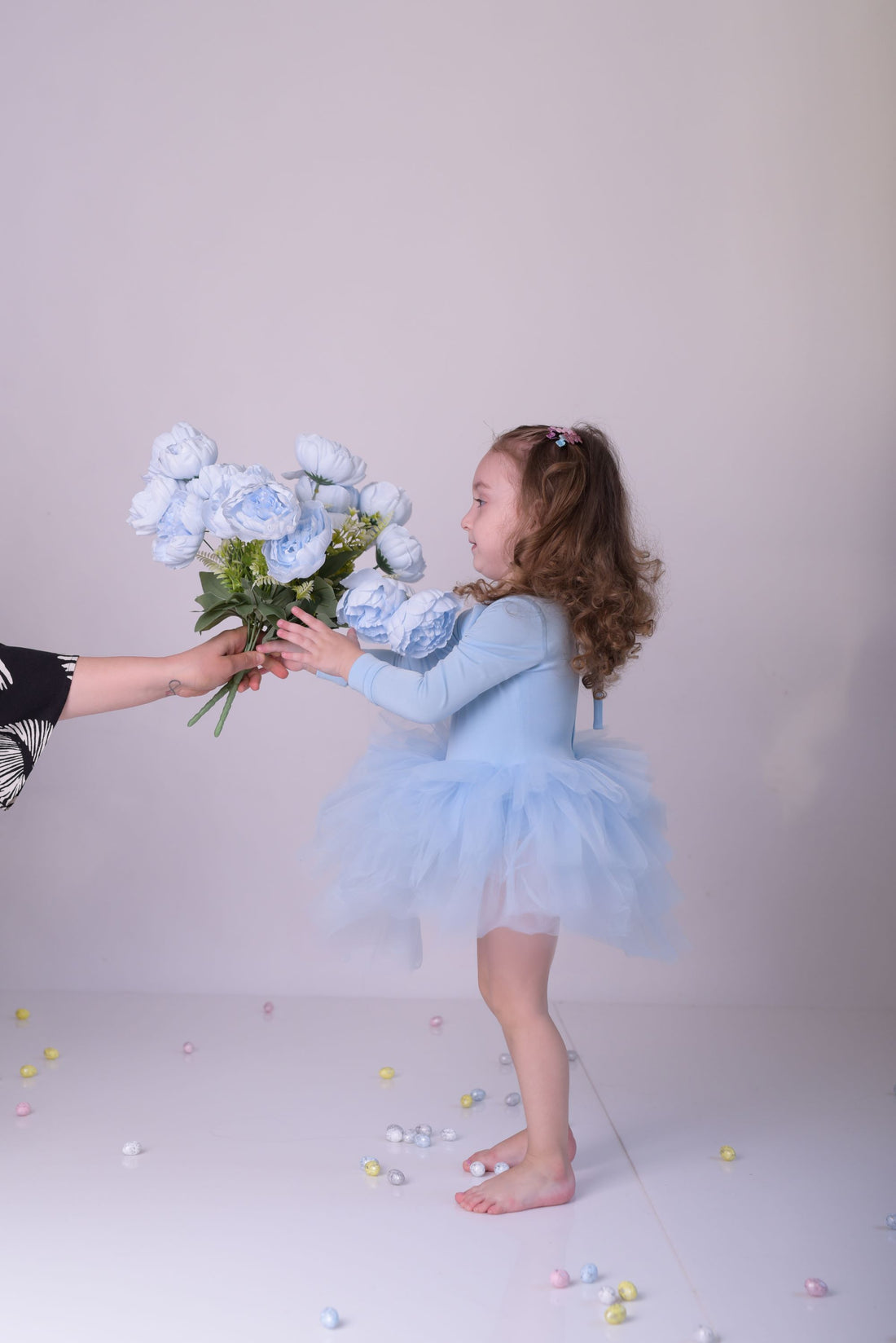 a little girl in a blue dress holding a bouquet of flowers Baby Girl Dress for Special Occasion