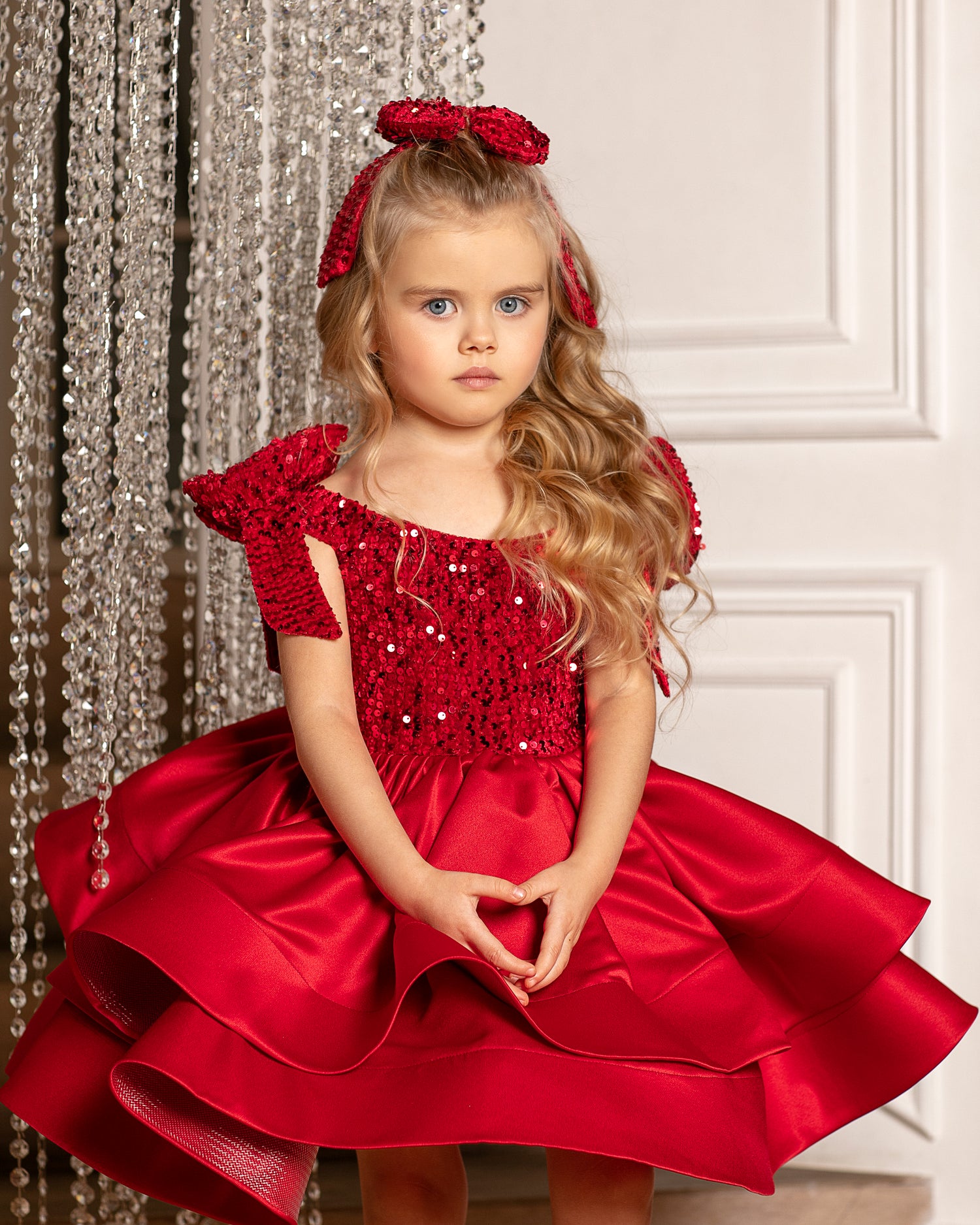 Elegant red velvet Christmas dress for toddler girls, featuring a satin fabric and a sparkling bow. Baby Girl Dress