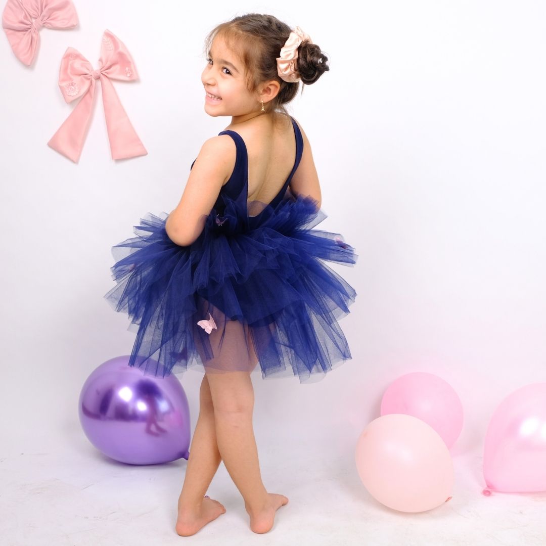 a little girl standing next to balloons and balloons Baby Girl Dress for Special Occasion