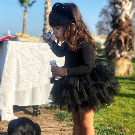 Black ballerina tutu for girls, featuring a classic design perfect for dance recitals, performances, and dress-up. Baby Girl Dress