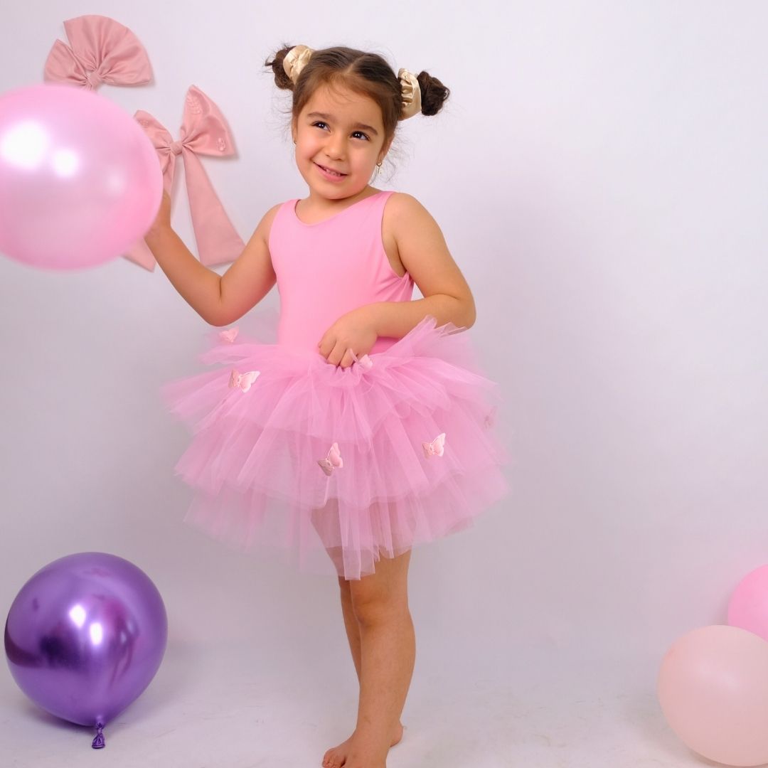 a little girl in a pink tutu holding a balloon Baby Girl Dress for Special Occasion