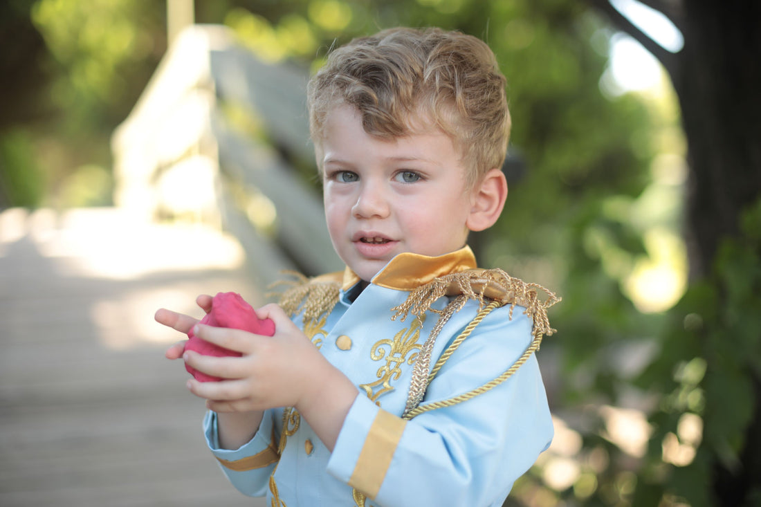 Prince Charming sky blue costume for boys, featuring a light blue jacket with gold detailing and matching pants. Ideal for costume parties or dress-up events, this outfit offers a classic fairytale look with a soft, elegant touch. Baby Girl Dress for Special Occasion