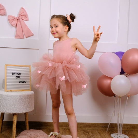 a little girl in a pink dress posing for a picture Baby Girl Dress