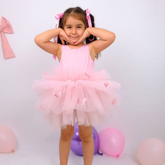 a little girl in a pink dress posing for a picture Baby Girl Dress
