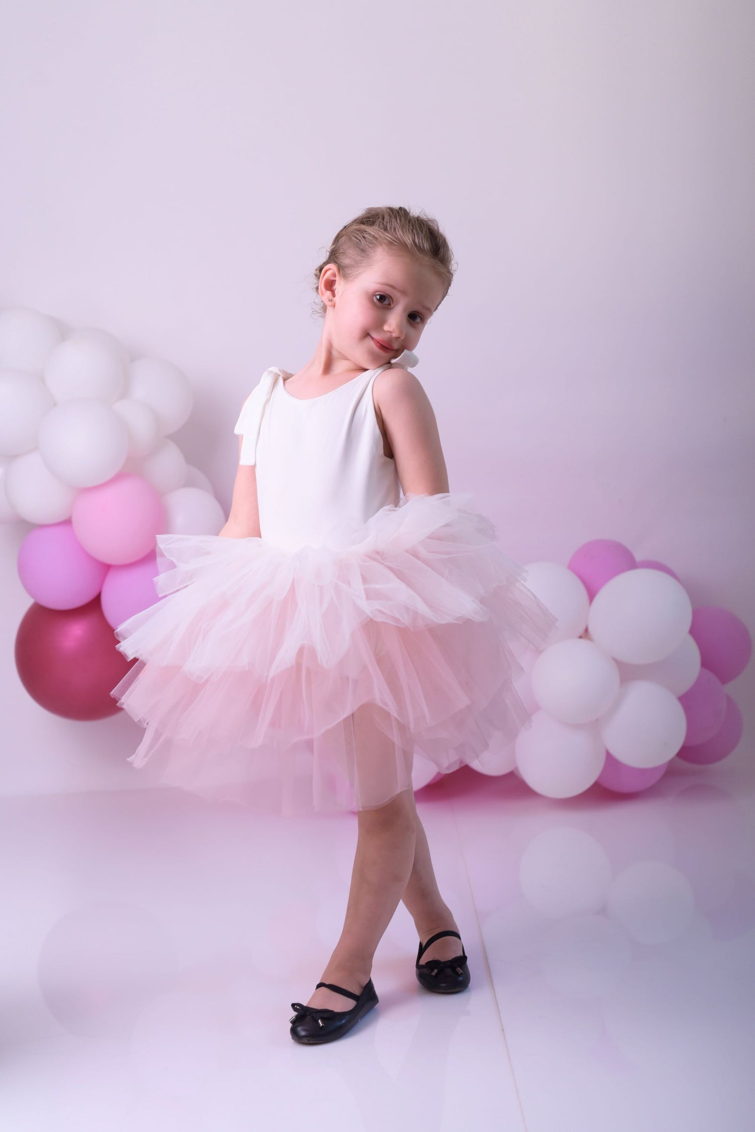 a little girl wearing a pink tutu and a white dress Baby Girl Dress