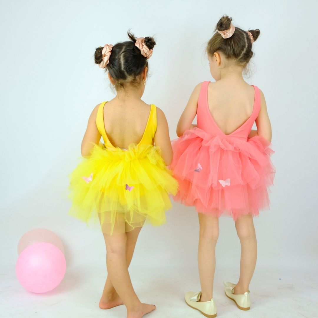 two little girls dressed in colorful tutus and ballet shoes Baby Girl Dress for Special Occasion
