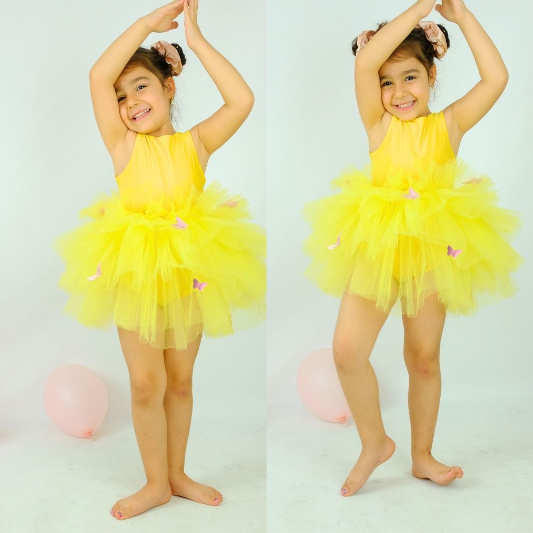 a little girl wearing a yellow tutu and a yellow dress Baby Girl Dress for Special Occasion