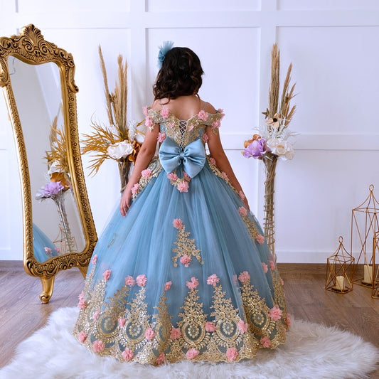The bodice of the light pastel blue dress is laced and has laser flowers on it. The whole skirt is embroidered with lace and tulle on tulle. Baby Girl Dress