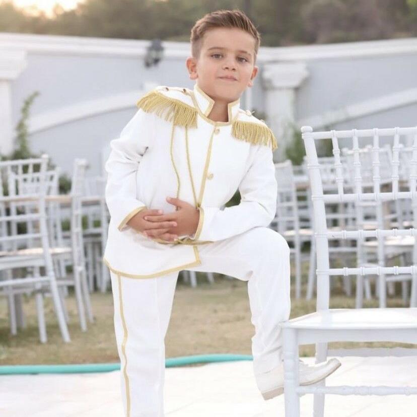Full outfit of the boys' Prince Charming tuxedo set – From the bow tie to the vest and pants, this charming white suit offers a cohesive, formal ensemble, giving young boys a princely appearance. Ideal for weddings, baptisms, and other significant milestones. Baby Girl Dress