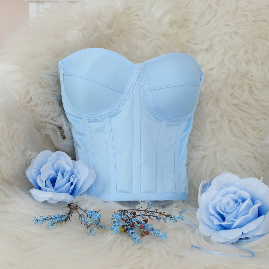 a blue corset and flowers on a furry surface Baby Girl Dress for Special Occasion