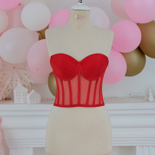a mannequin with a red bra on it