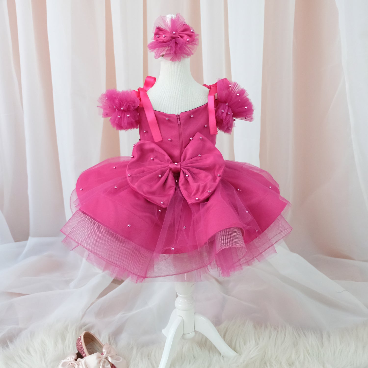 a pink dress and shoes on a mannequin Baby Girl Dress