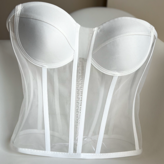 a white corset on a white surface Baby Girl Dress
