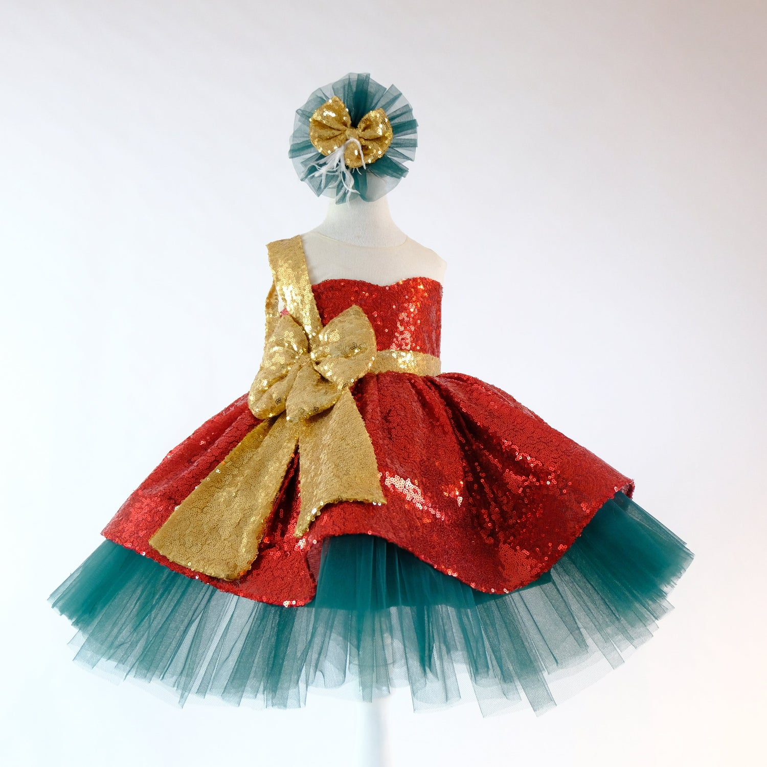 a red and blue dress with a gold bow Baby Girl Dress