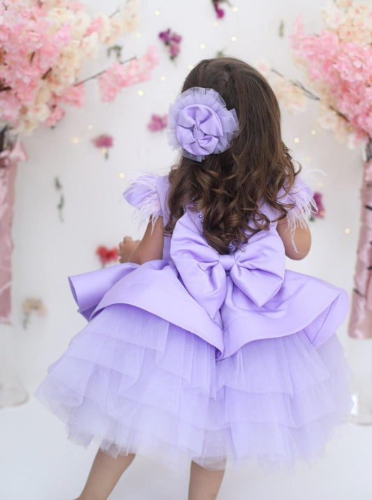 Elegant lilac dress adorned with pearls, made from cotton, tulle, and satin. Perfect for special occasions, offering comfort and style for girls.