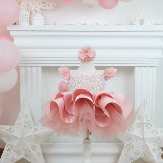 a baby girl's pink and white dress and star decorations Baby Girl Dress
