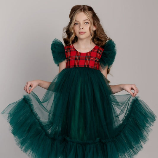 a little girl wearing a green and red dress Baby Girl Dress