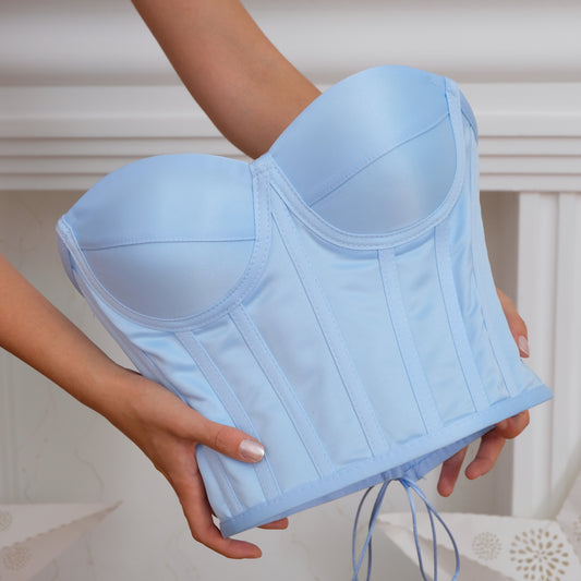 a woman holding a blue bra in her hands Baby Girl Dress