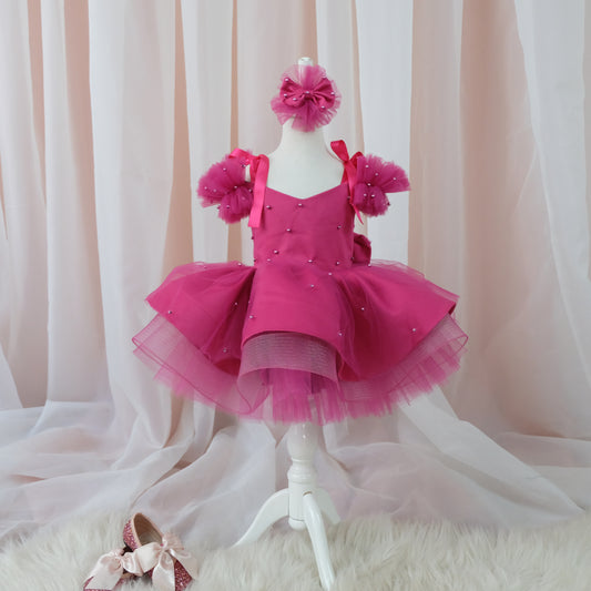 a little girl's pink dress and shoes on a mannequin Baby Girl Dress