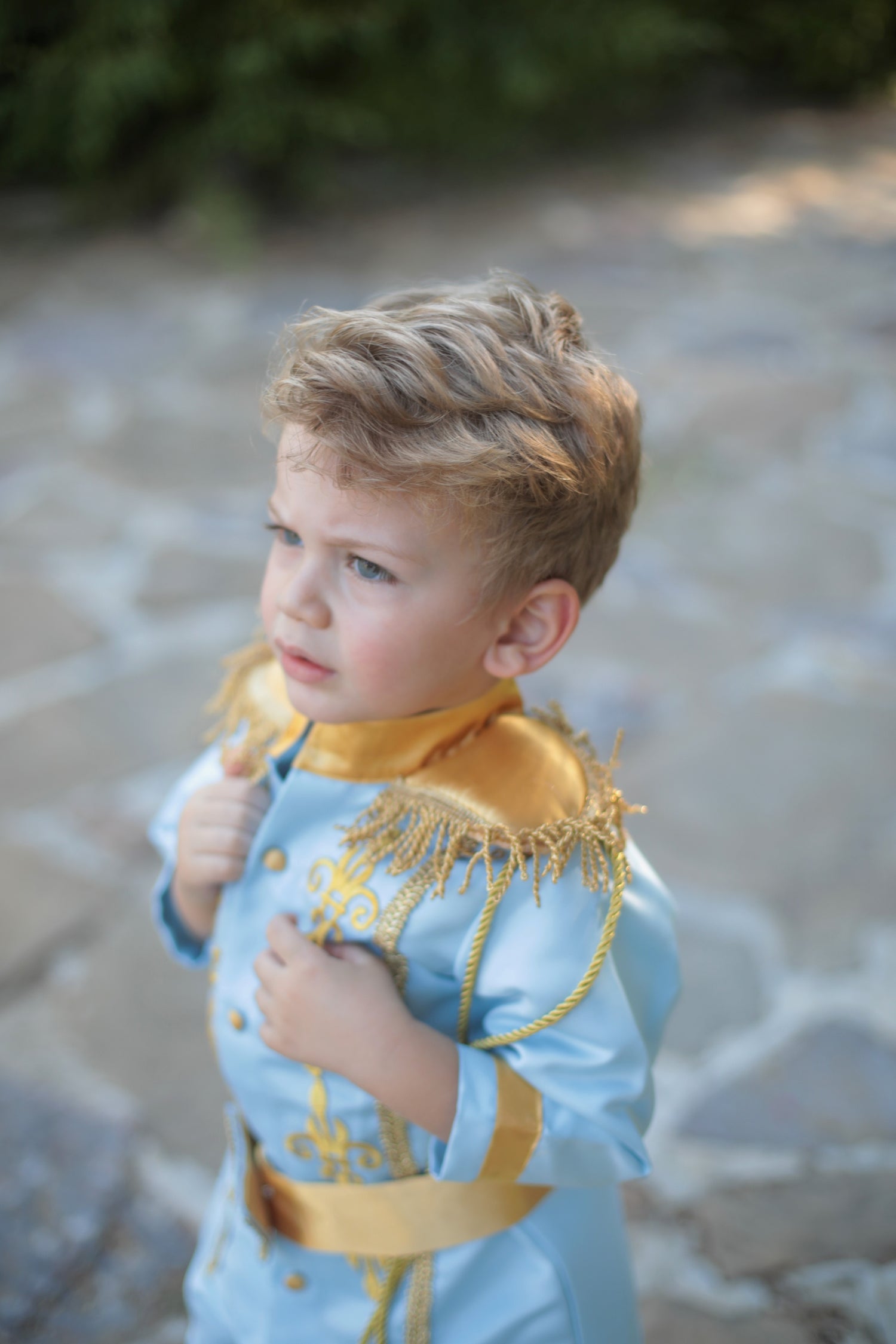 Prince Charming sky blue costume for boys, featuring a light blue jacket with gold detailing and matching pants. Ideal for costume parties or dress-up events, this outfit offers a classic fairytale look with a soft, elegant touch. Baby Girl Dress