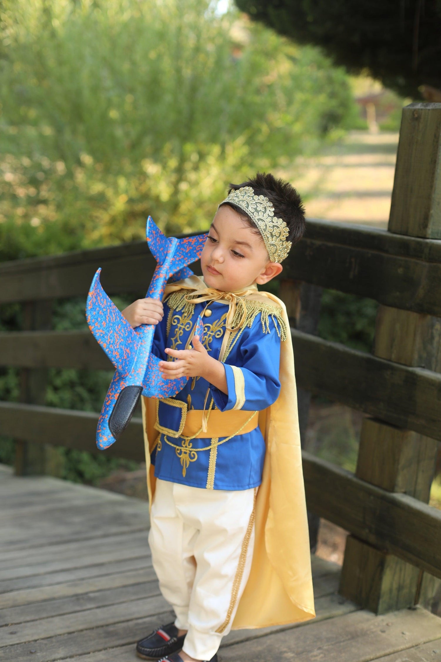 Prince Charming blue costume for boys, featuring a regal blue jacket with gold trim and matching pants. Ideal for costume parties or dress-up play, this outfit captures the classic fairytale look with elegant details. Baby Girl Dress
