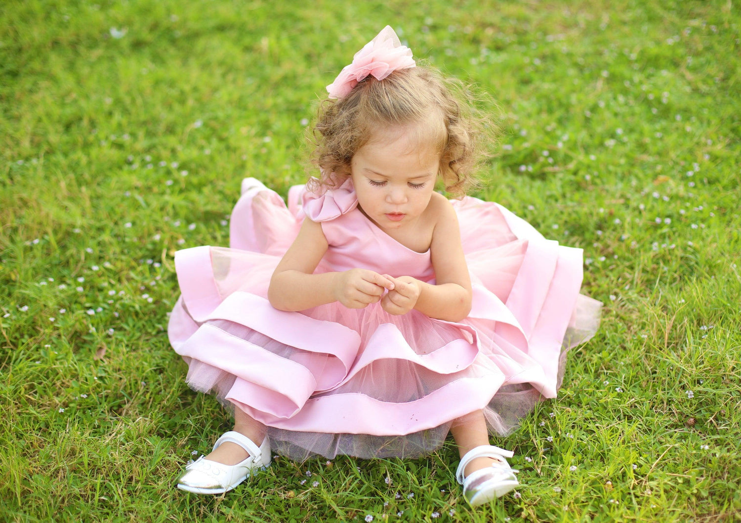 Elegant blush pink one-shoulder dress for girls, featuring a sleek silhouette and a gently draped sleeve. The dress flows gracefully, making it a perfect choice for weddings, parties, or any special occasion. Baby Girl Dress