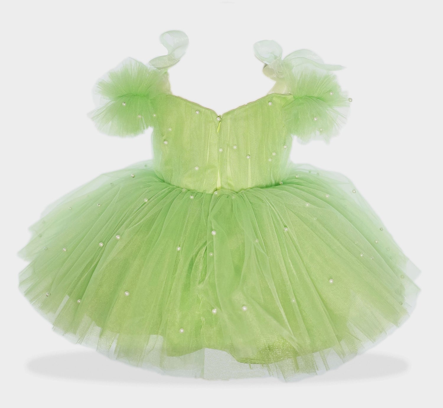 a little girl in a green dress on a white background Baby Girl Dress
