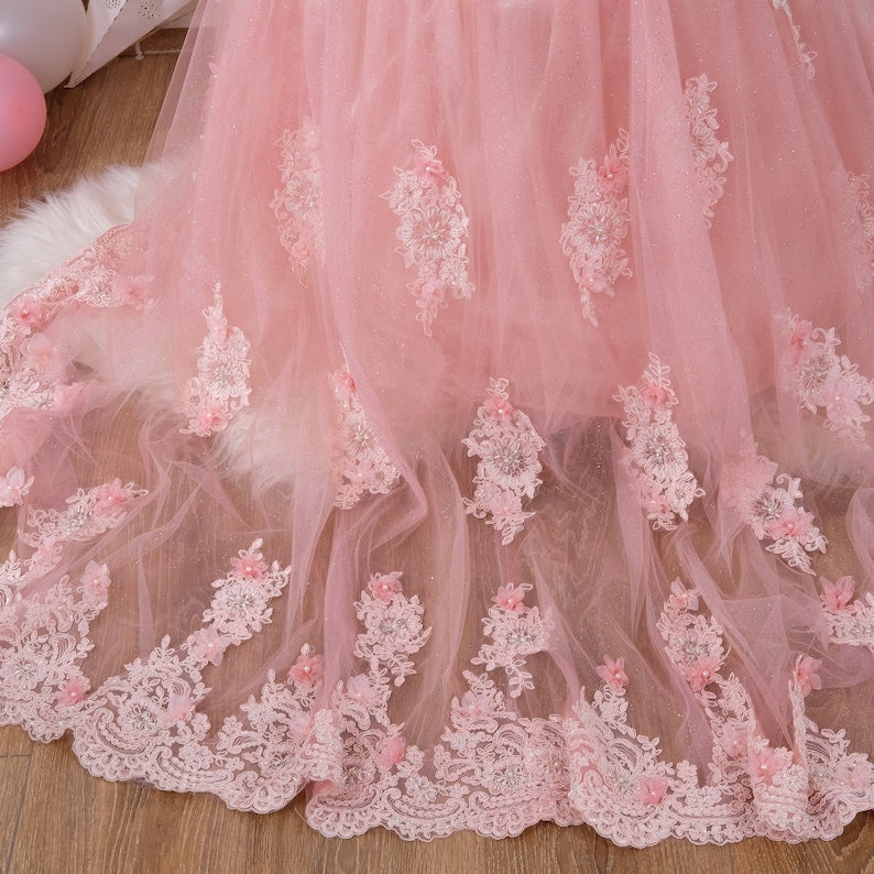 Capture the essence of your quinceañera with this beautiful blush dress. Designed with delicate embellishments and a classic silhouette, this gown promises to make you the highlight of your celebration. Ideal for young women who want to combine tradition with a touch of modern style. Baby Girl Dress