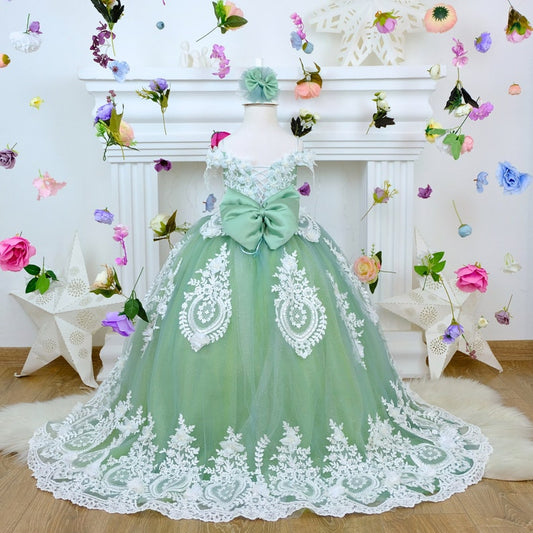 Beautiful sage green Quinceañera dress featuring a graceful design and elegant detailing. The soft sage green color adds a touch of sophistication, making it perfect for a stylish and memorable Quinceañera celebration. Baby Girl Dress
