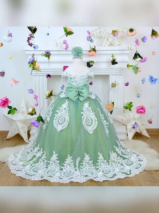The corset part of the sage green dress is laced and has laser flowers on it. The whole skirt is embroidered with lace and tulle on tulle.