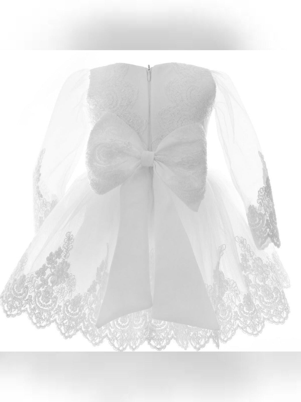 a white dress with a bow on it