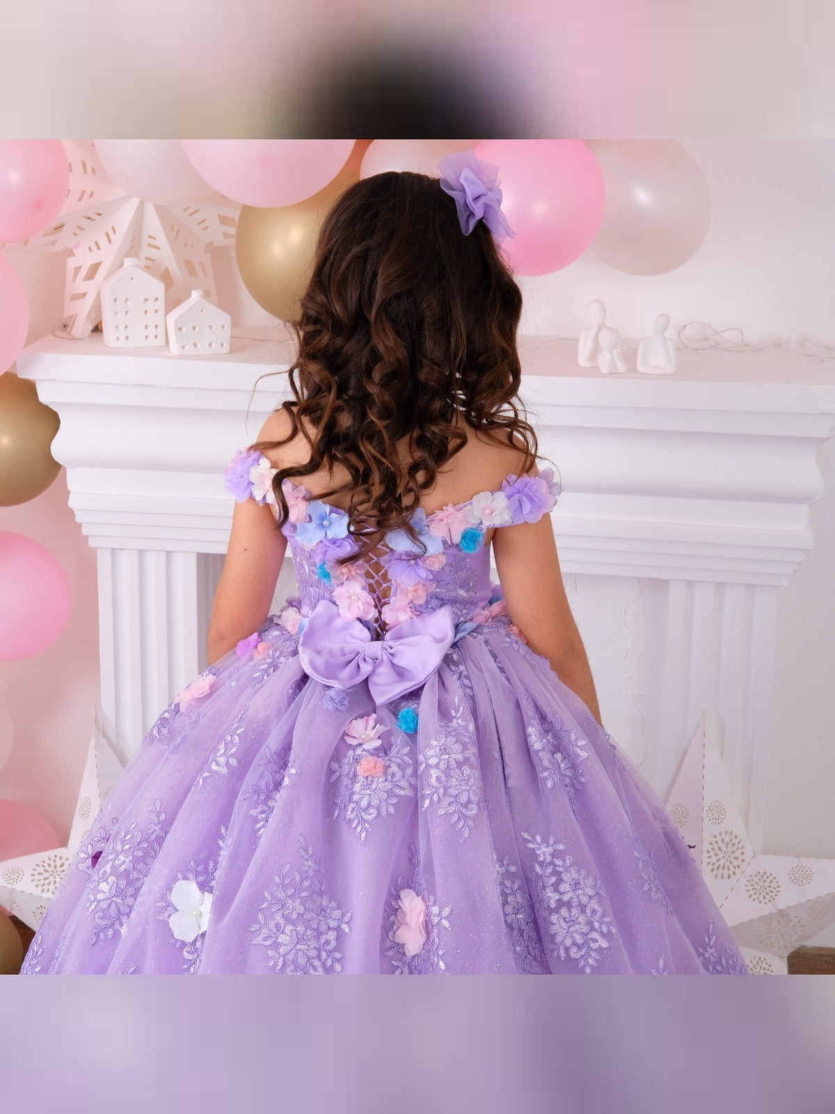 Lilac Quinceañera dress with elegant design and detailed embellishments, perfect for celebrating special occasions. Features a flowing skirt and sophisticated detailing, ideal for a memorable celebration.