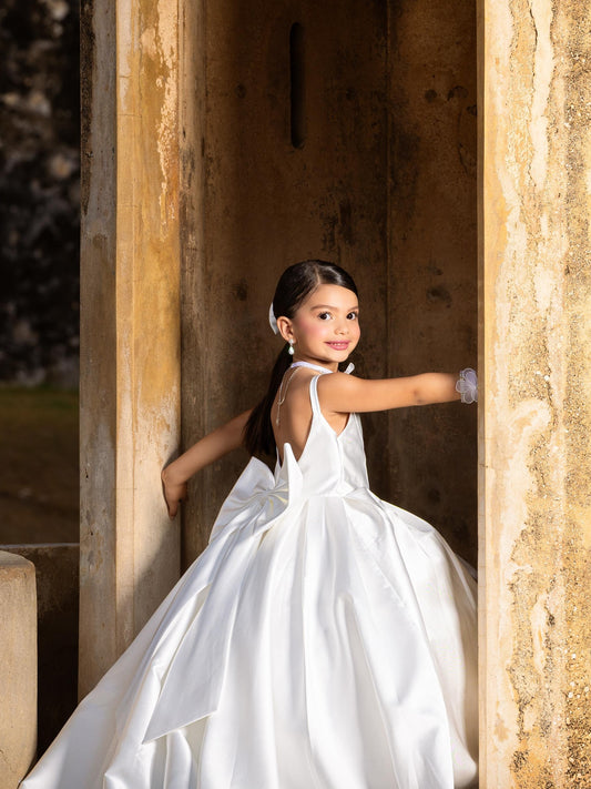 White satin flower girl dress with bow back and train