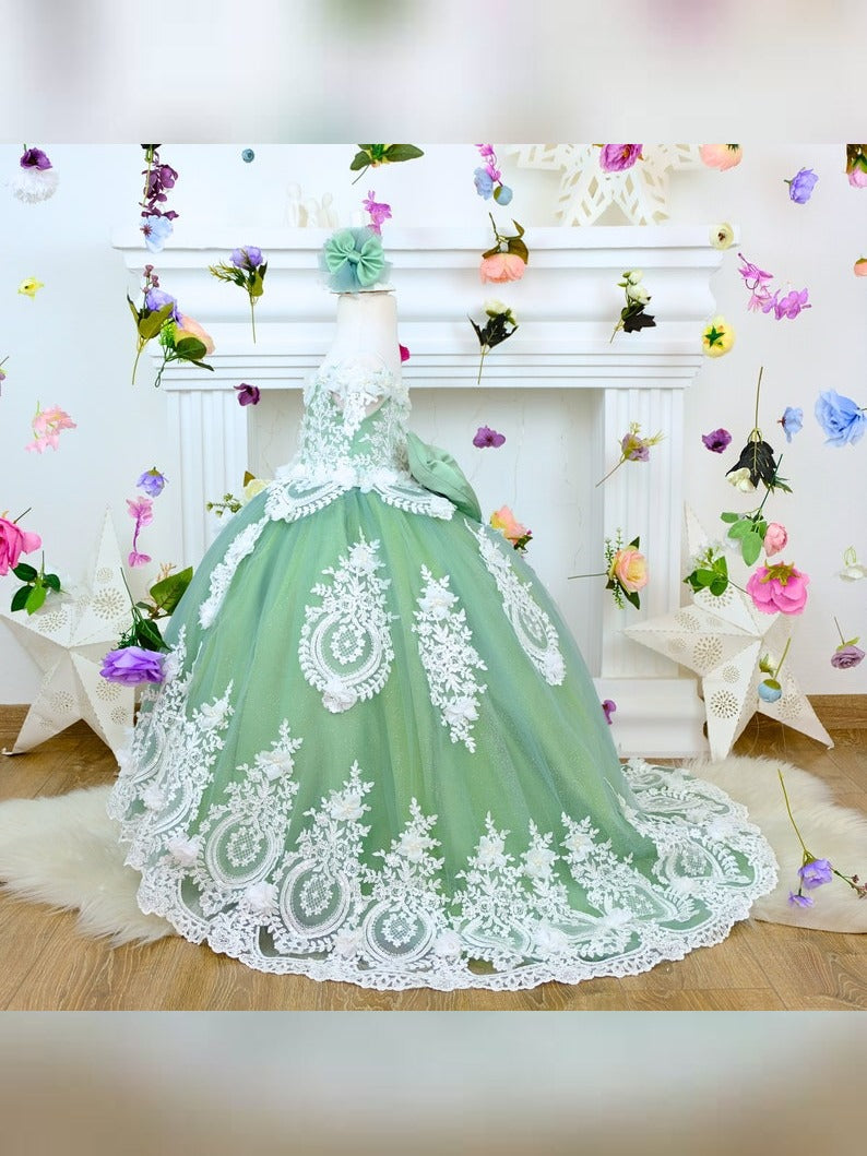 The corset part of the sage green dress is laced and has laser flowers on it. The whole skirt is embroidered with lace and tulle on tulle.