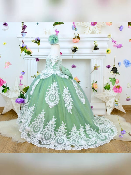 The corset part of the sage green dress is laced and has laser flowers on it. The whole skirt is embroidered with lace and tulle on tulle.
