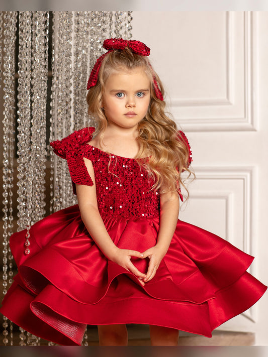 Elegant red velvet Christmas dress for toddler girls, featuring a satin fabric and a sparkling bow.