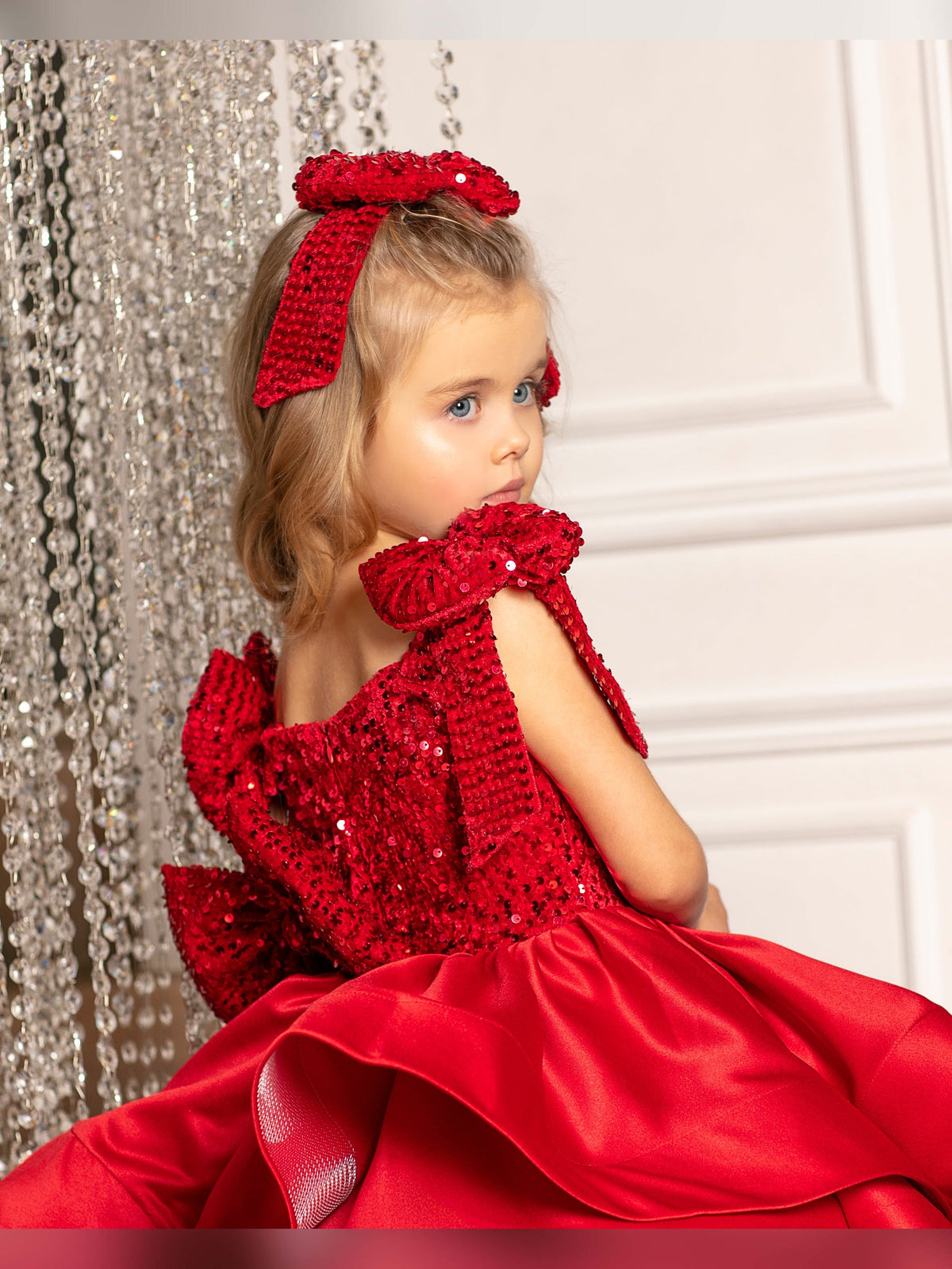 Holiday-ready toddler girl dress in velvet red satin with a gorgeous big bow for Christmas.