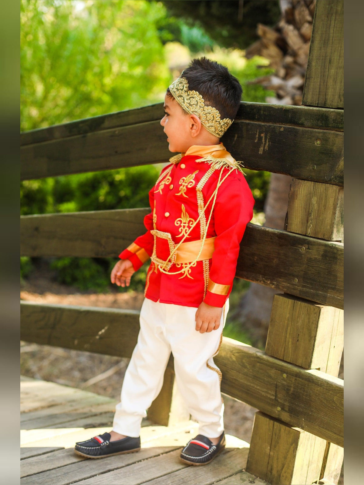 Prince Charming red costume for boys, featuring a striking red jacket with gold accents and matching pants. Perfect for costume parties or themed events, this outfit embodies the classic fairytale prince look