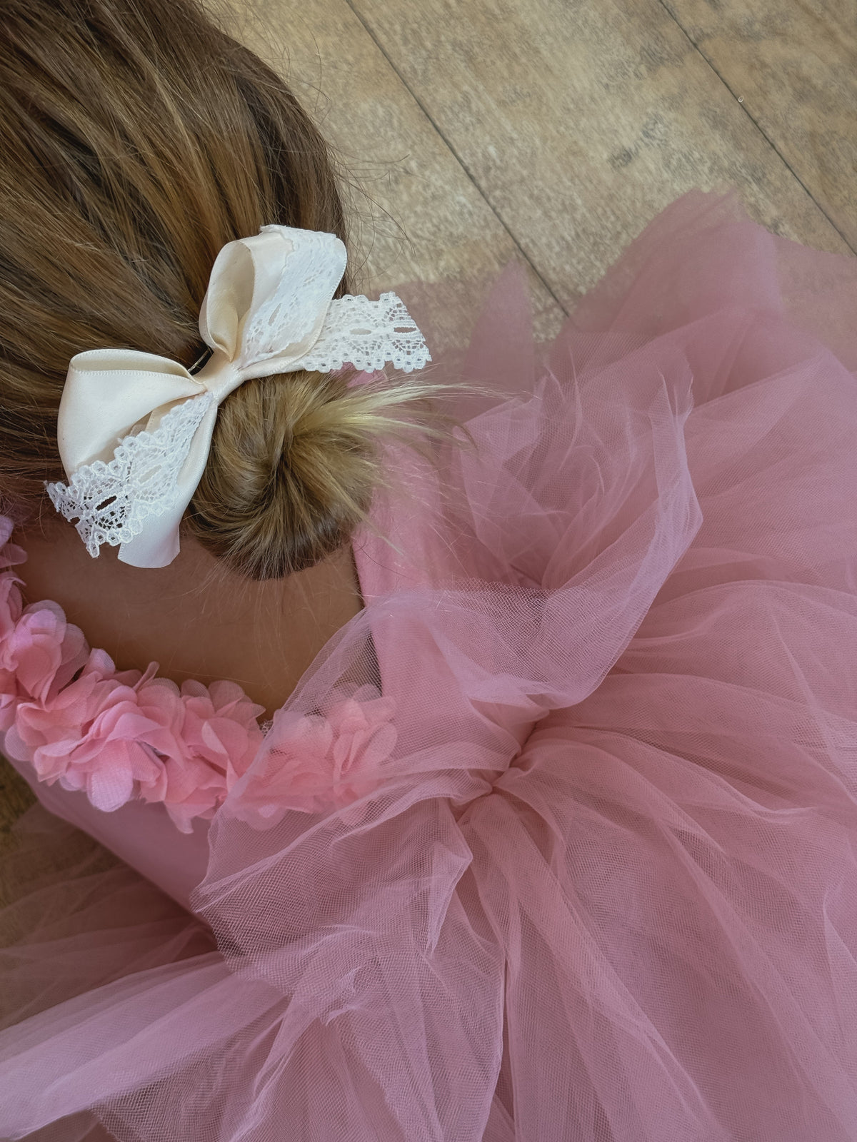 Soft blush tutu for girls with floral embellishments, perfect for ballet and special occasions.