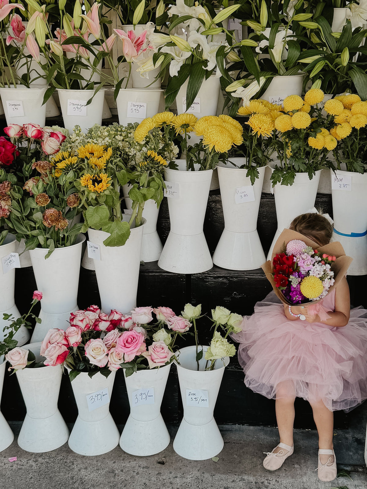 Soft blush tutu for girls with floral embellishments, perfect for ballet and special occasions.