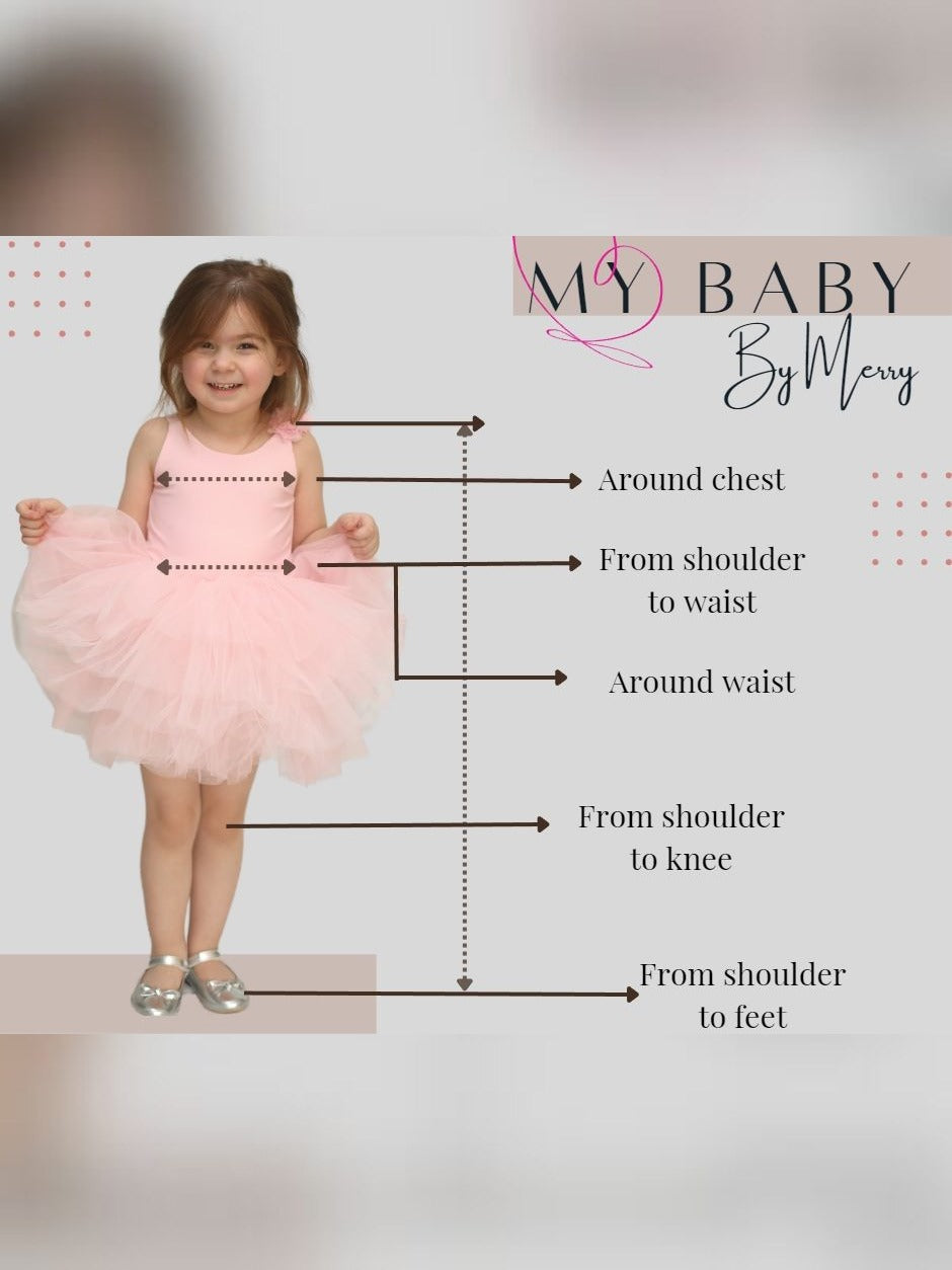 a little girl in a pink dress with her measurements