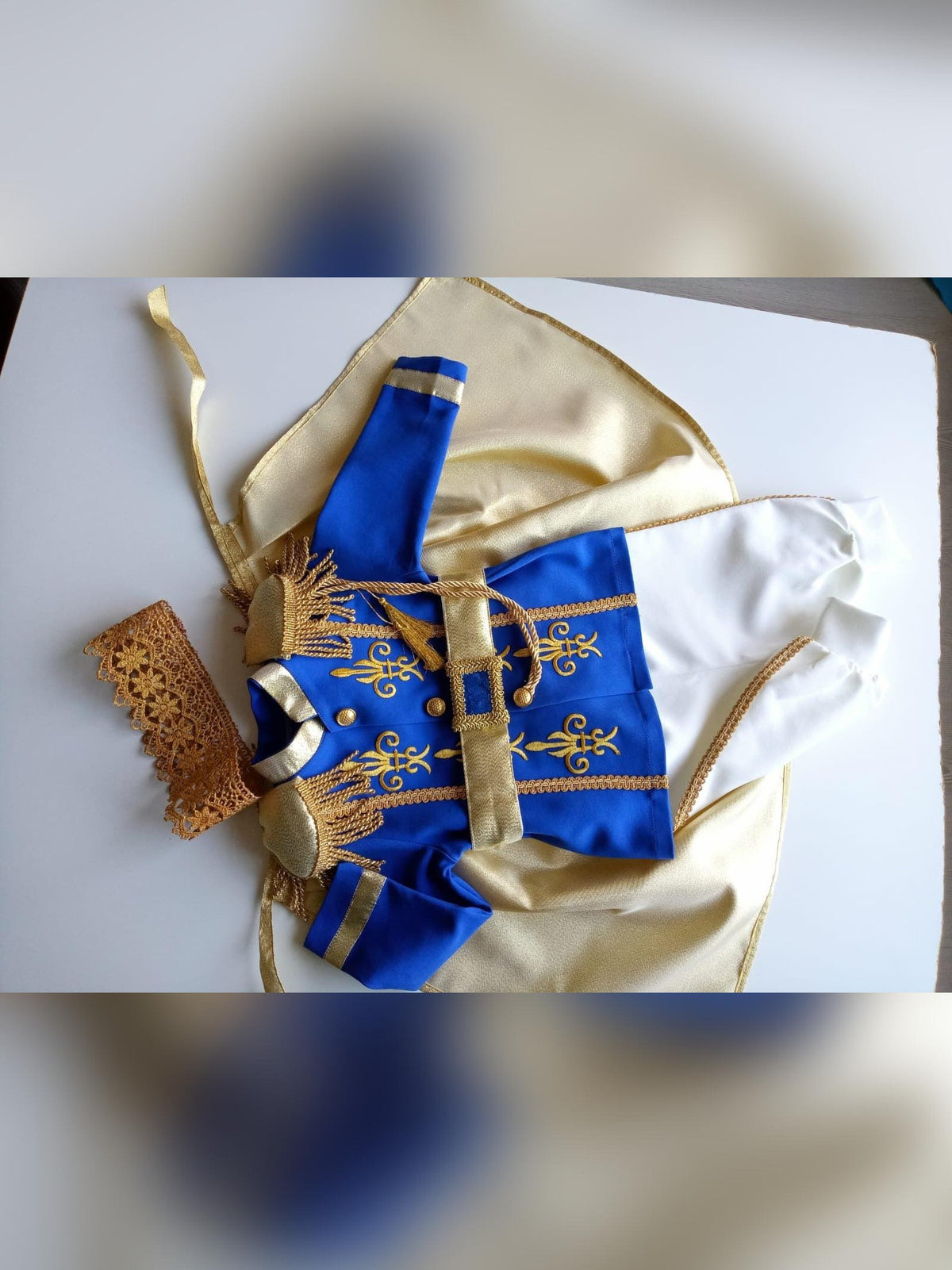 Prince Charming blue costume for boys, featuring a regal blue jacket with gold trim and matching pants. Ideal for costume parties or dress-up play, this outfit captures the classic fairytale look with elegant details.