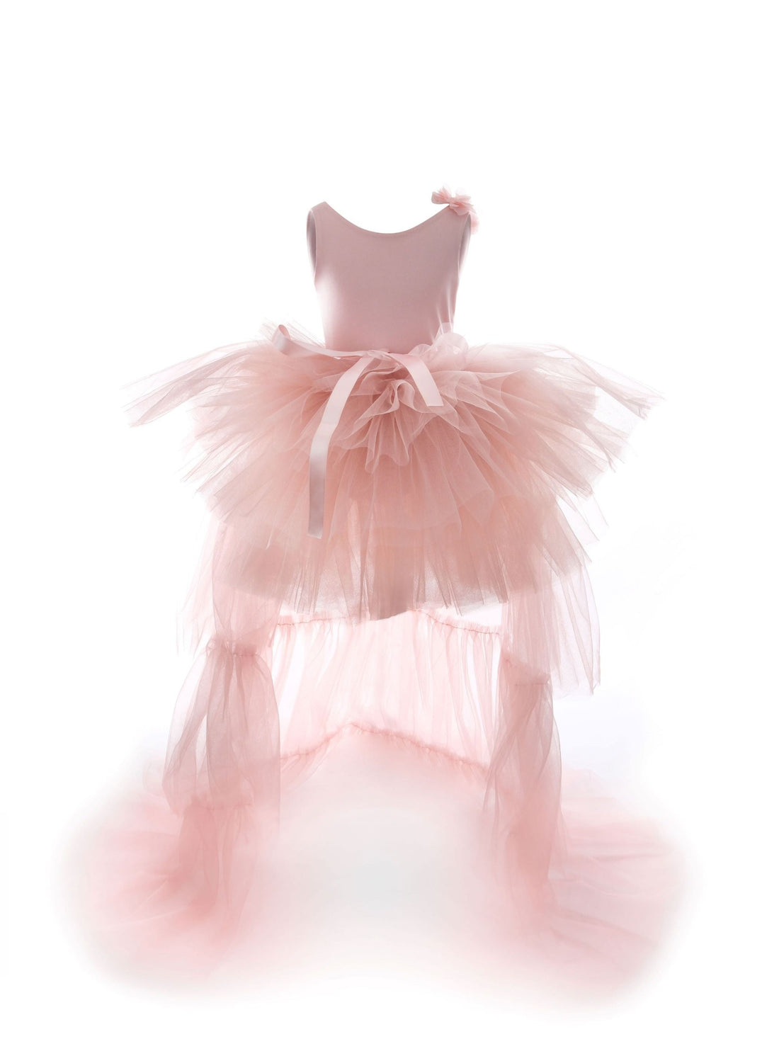 a little girl's pink dress sitting on top of a stool