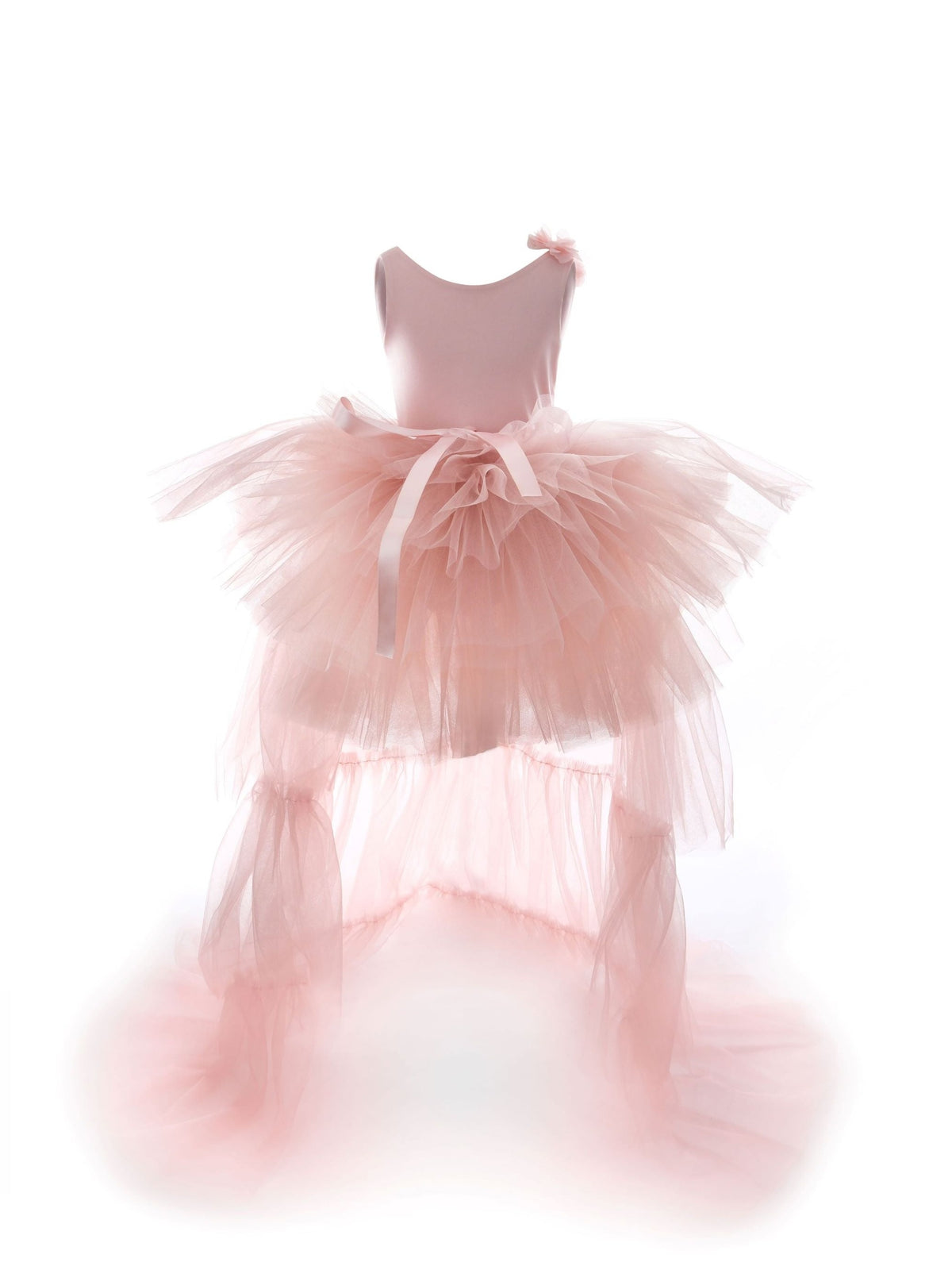 a little girl's pink dress sitting on top of a stool
