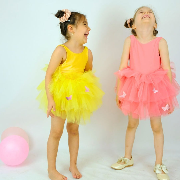 two little girls standing next to each other