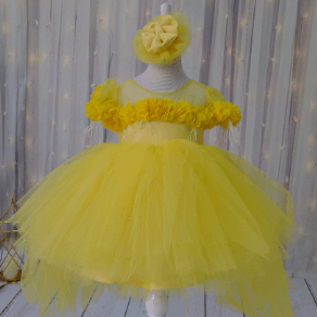 a dress made of yellow tulle and flowers