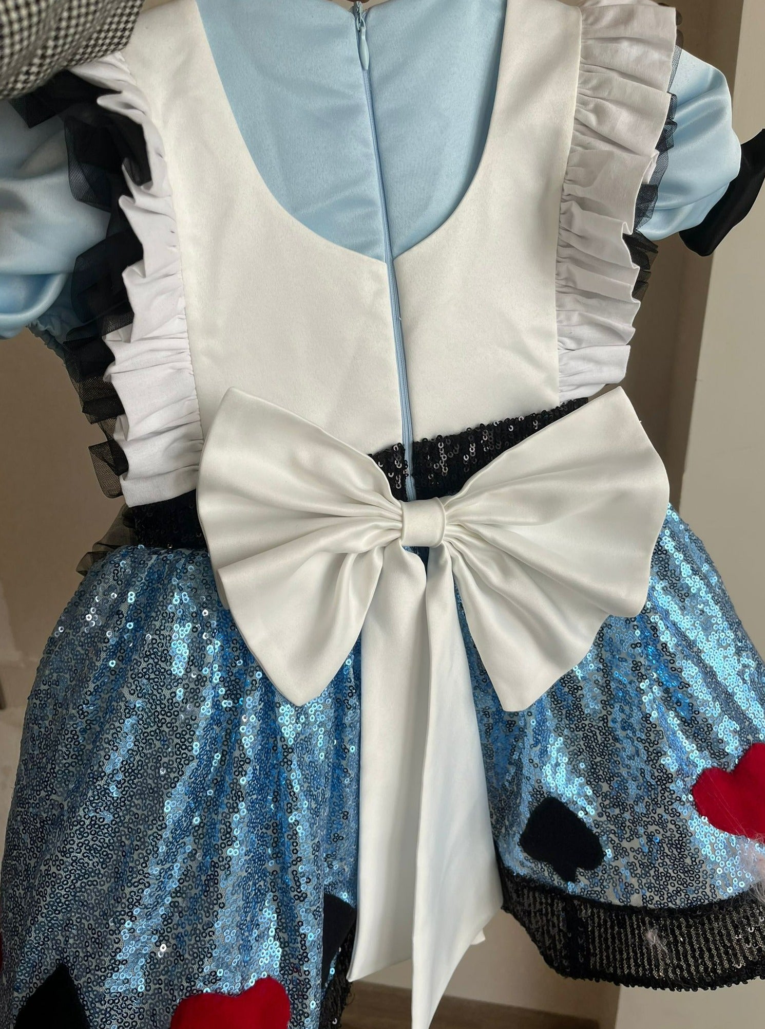 Sparkle in our Alice in Wonderland sequin blue dress, perfect for costume parties or themed events. This enchanting dress combines classic fairytale charm with shimmering sequins for a magical look. Available in various sizes to ensure a comfortable and dazzling fit