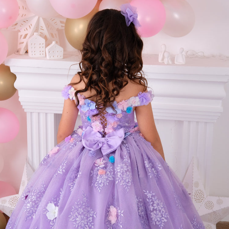 Lilac Quinceañera dress with elegant design and detailed embellishments, perfect for celebrating special occasions. Features a flowing skirt and sophisticated detailing, ideal for a memorable celebration.