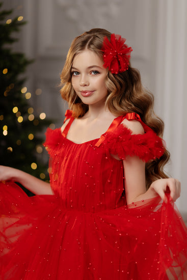 Christmas girl dress in festive red with pearl details, designed to make your child shine during holiday celebrations