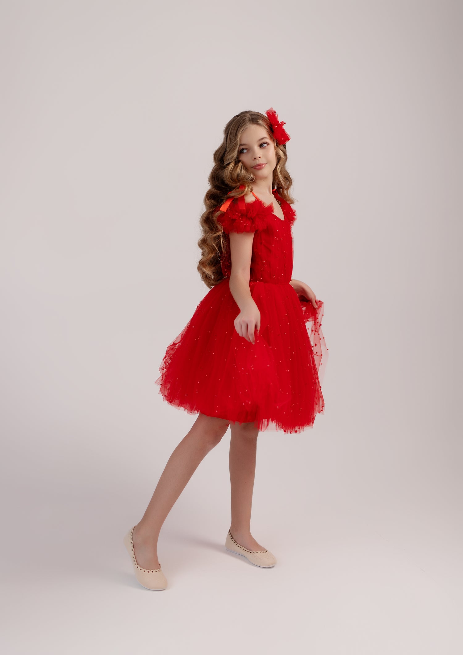 Stylish Christmas dress for girls, featuring an off-shoulder design and red pearl details for a festive look.